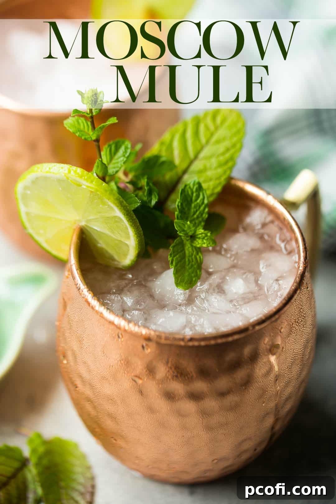 Moscow Mule cocktail in a copper mug with a text overlay above that reads "Moscow Mule."