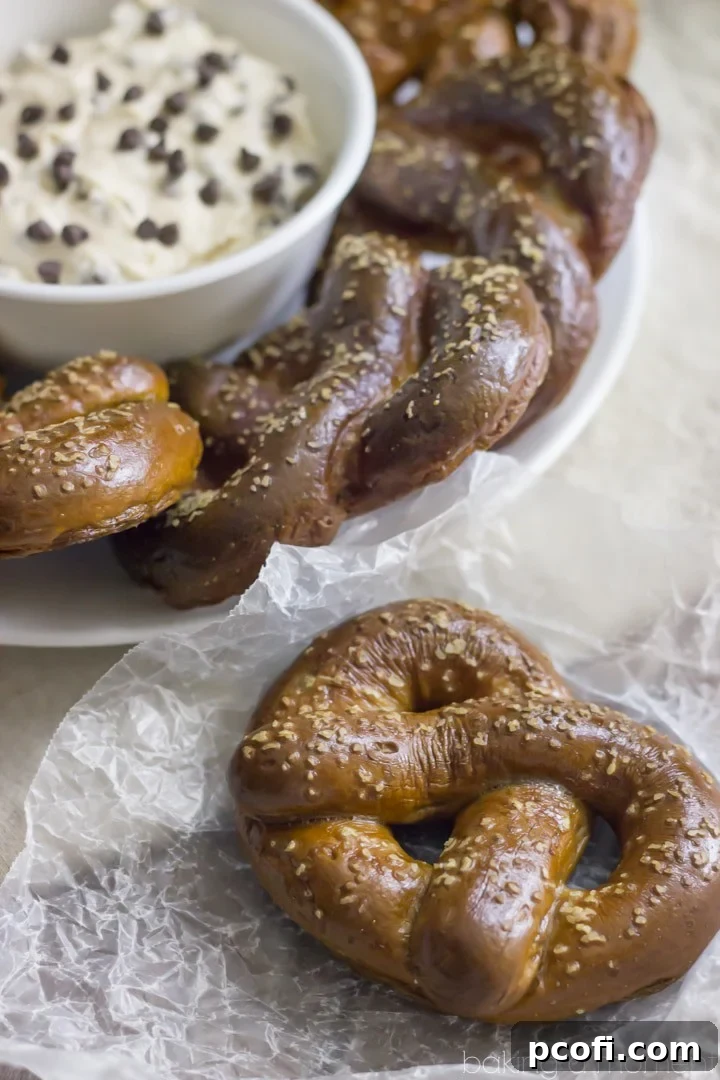 Homemade Soft Pretzels stuffed with Peanut Butter, served with a Malted Vanilla cream cheese Dip with Chocolate Chips. These Chubby Hubby Pretzels and Dip are totally outrageous! Perfect Superbowl dessert ;)