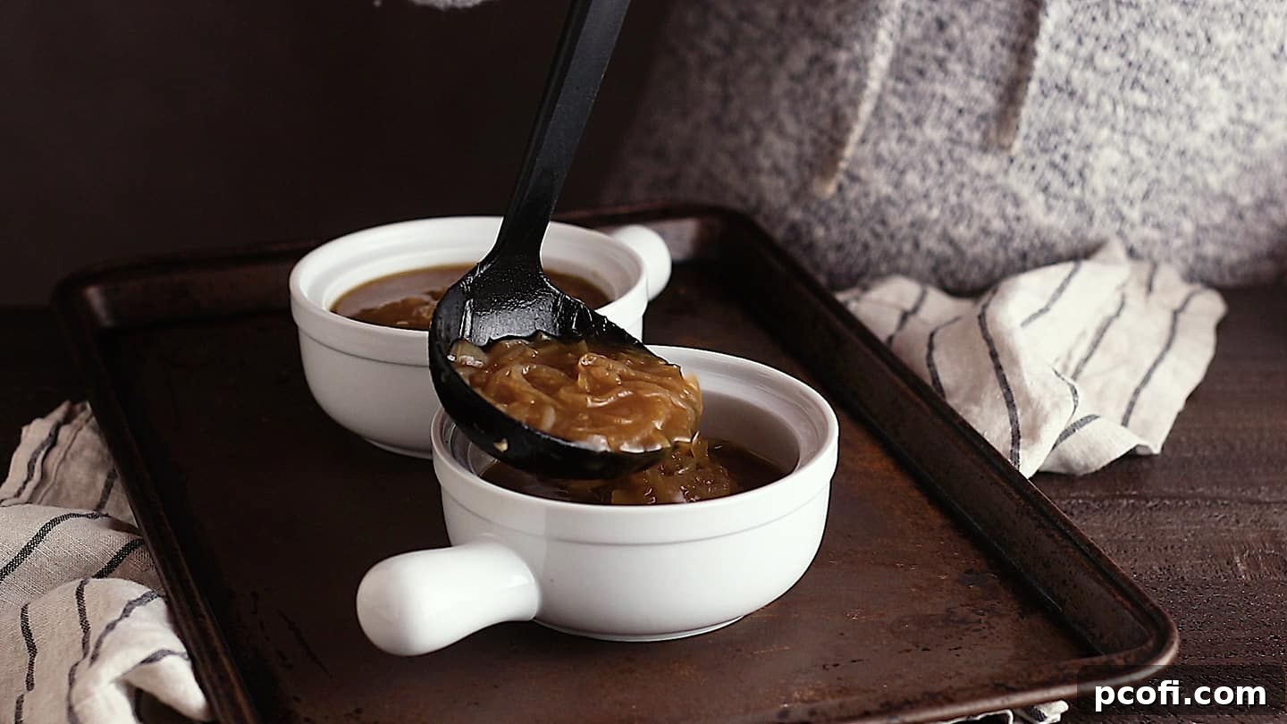 Ladling French onion soup into ceramic crocks.