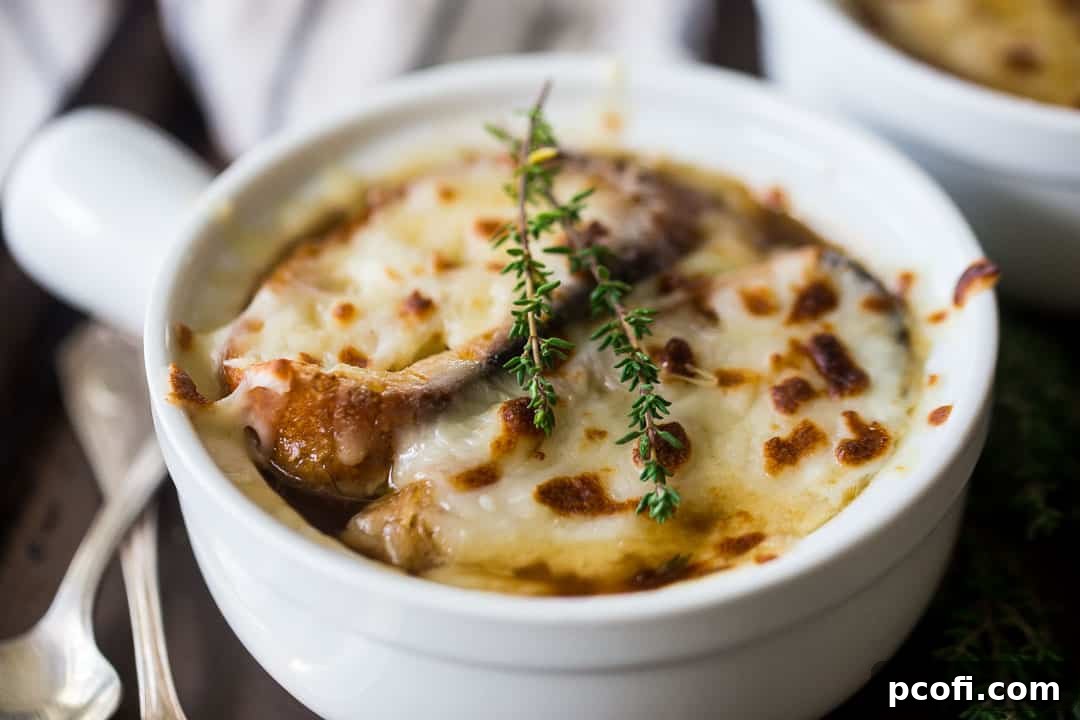Close up image of a bowl of crock pot French onion soup.