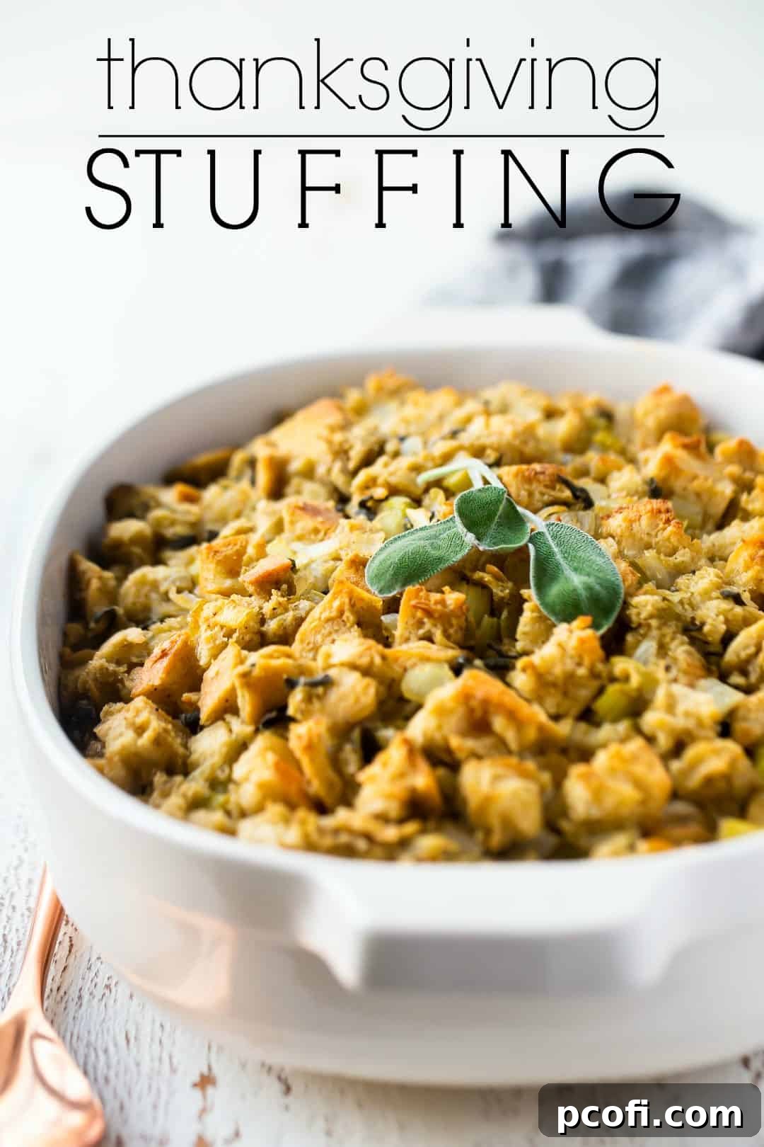 Thanksgiving stuffing in a white casserole dish with a text overlay above reading "Thanksgiving Stuffing."