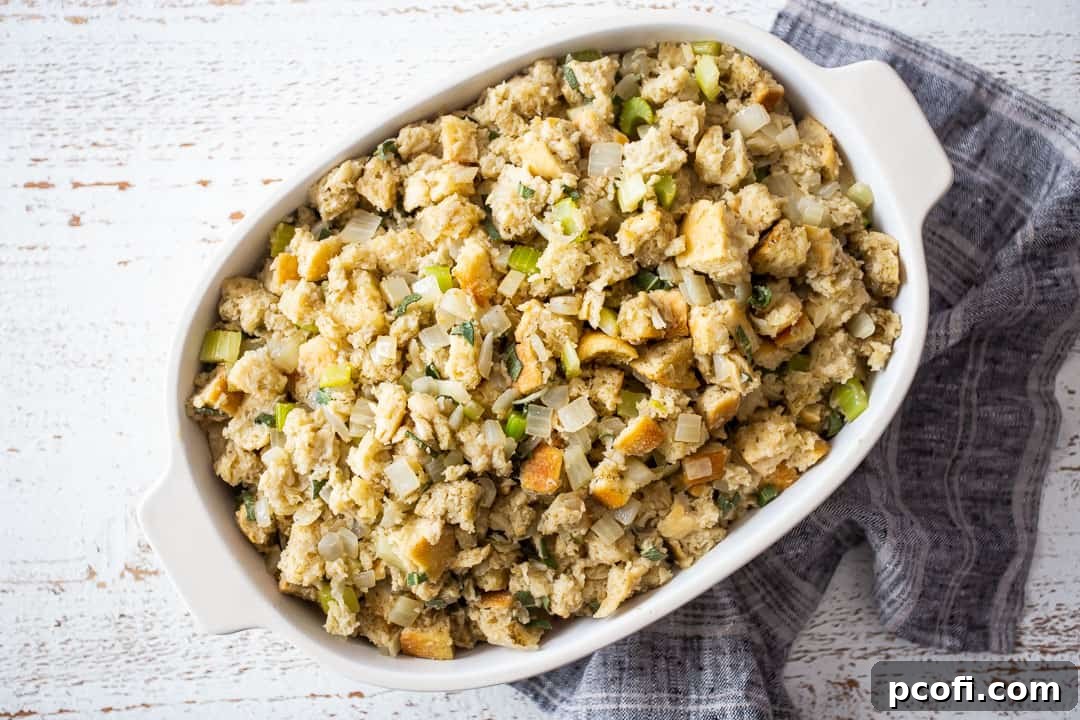 Unbaked Thanksgiving stuffing in a casserole dish.