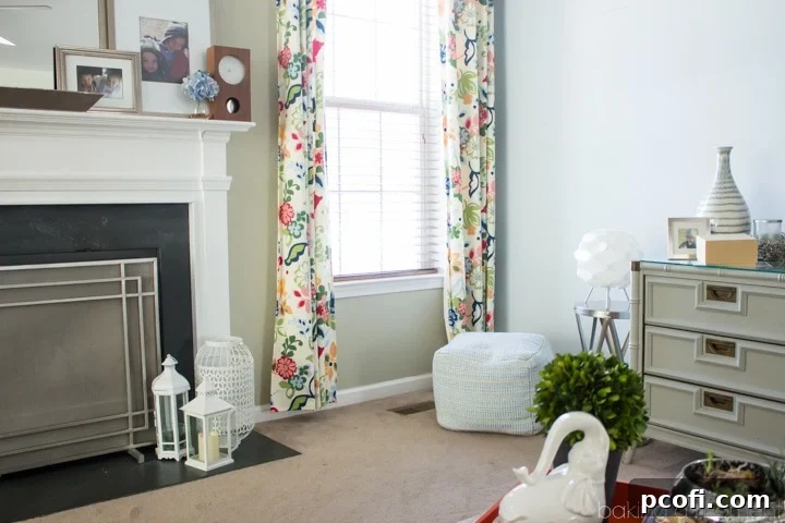 Corner of a living room that needs redecoration, with a lamp and bare walls