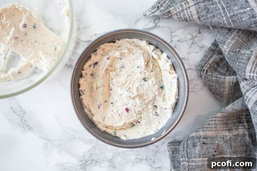 Cold crab dip in a gray stoneware serving bowl.