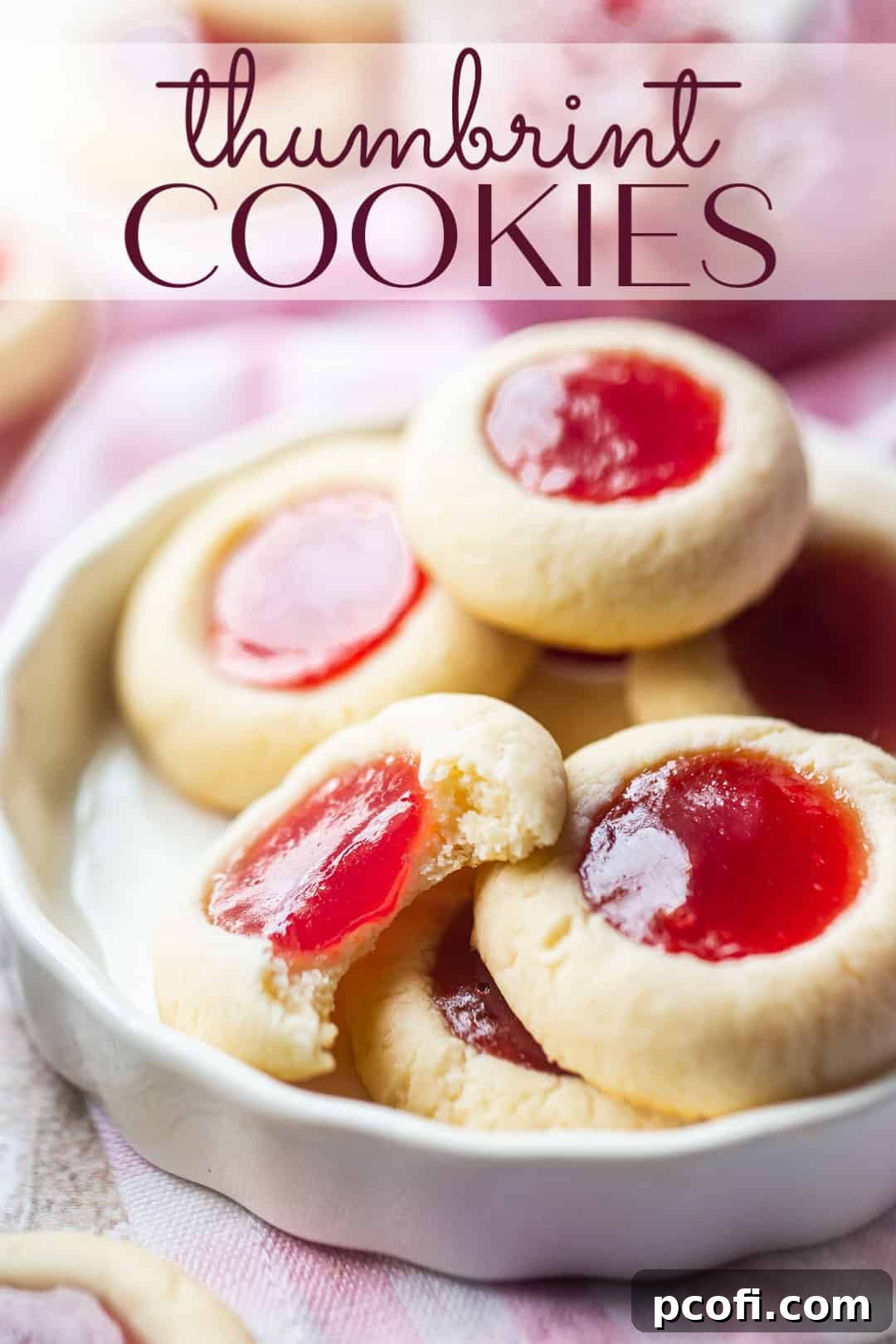 Thumbprint cookie recipe prepared and served in a white ceramic dish with a text overlay above reading "Thumbprint Cookies."
