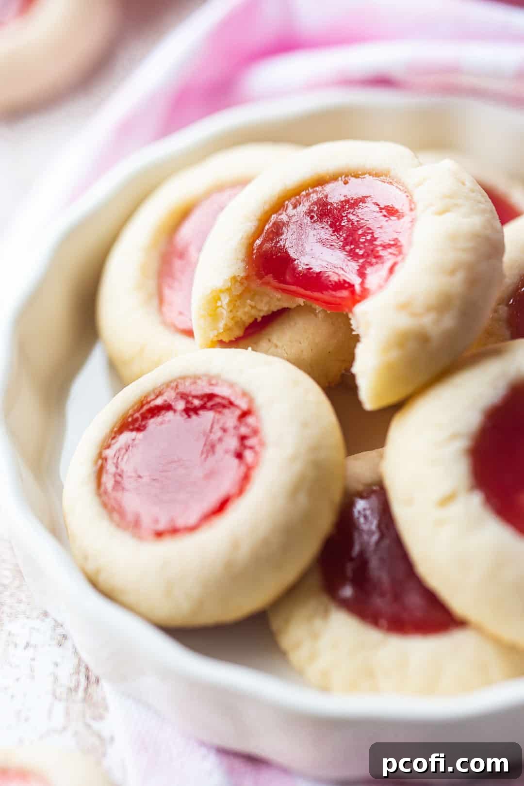 Close-up image of jam thumbprint cookies.