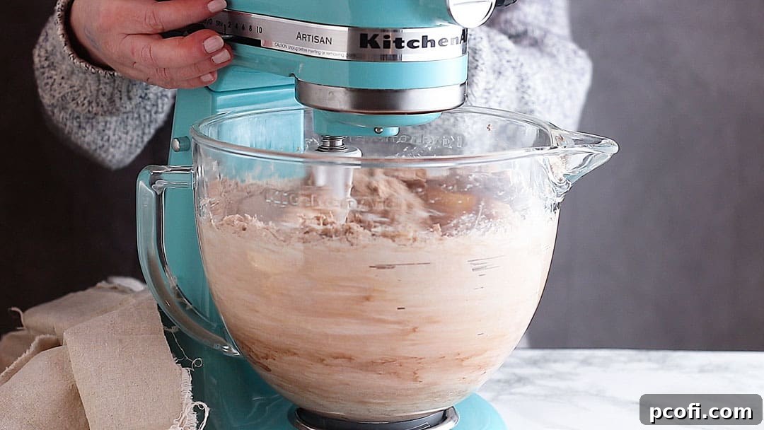 Mixing red velvet cheesecake batter.