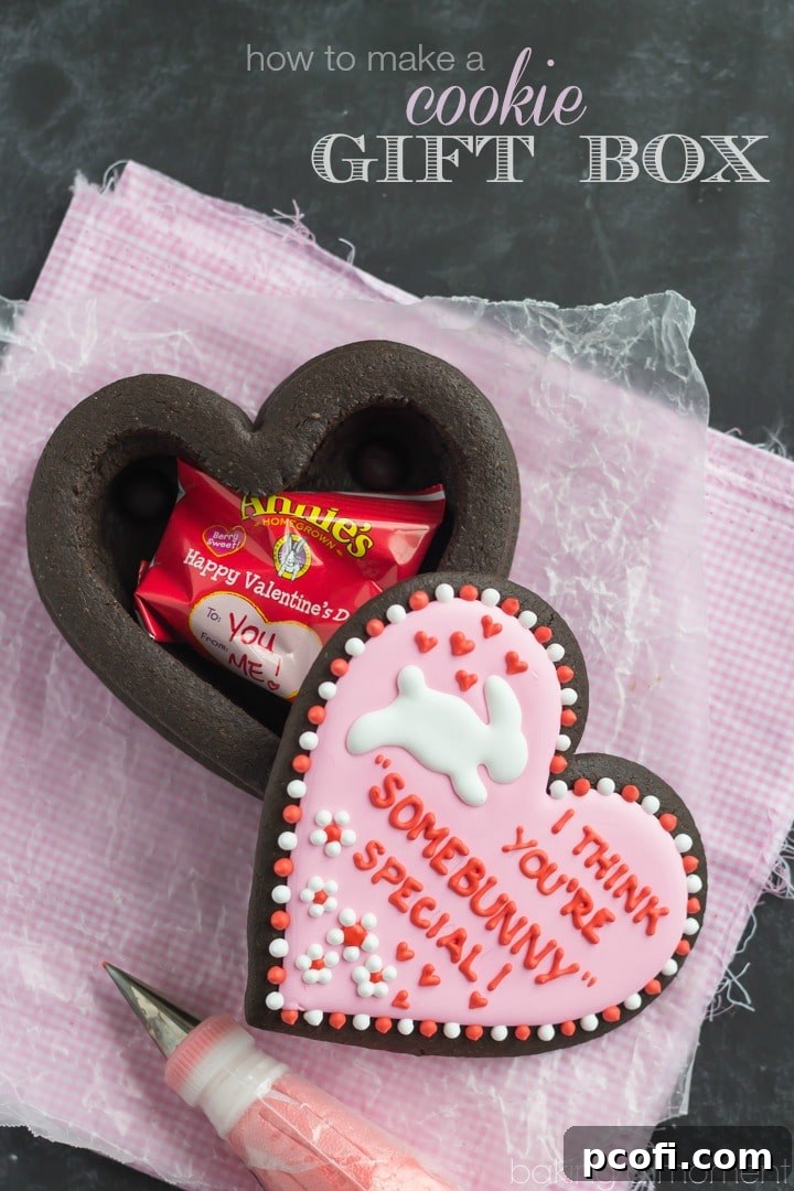 Detailed view of a heart-shaped cookie box, showcasing its edible construction and festive design.