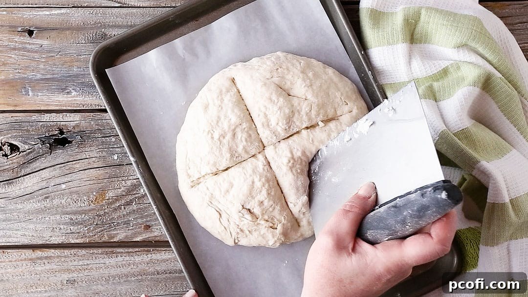Piercing Irish soda bread with the tip of a knife.