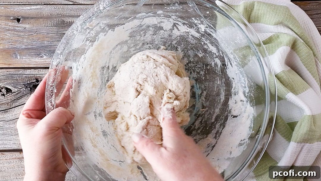 Forming Irish soda bread dough into a ball.