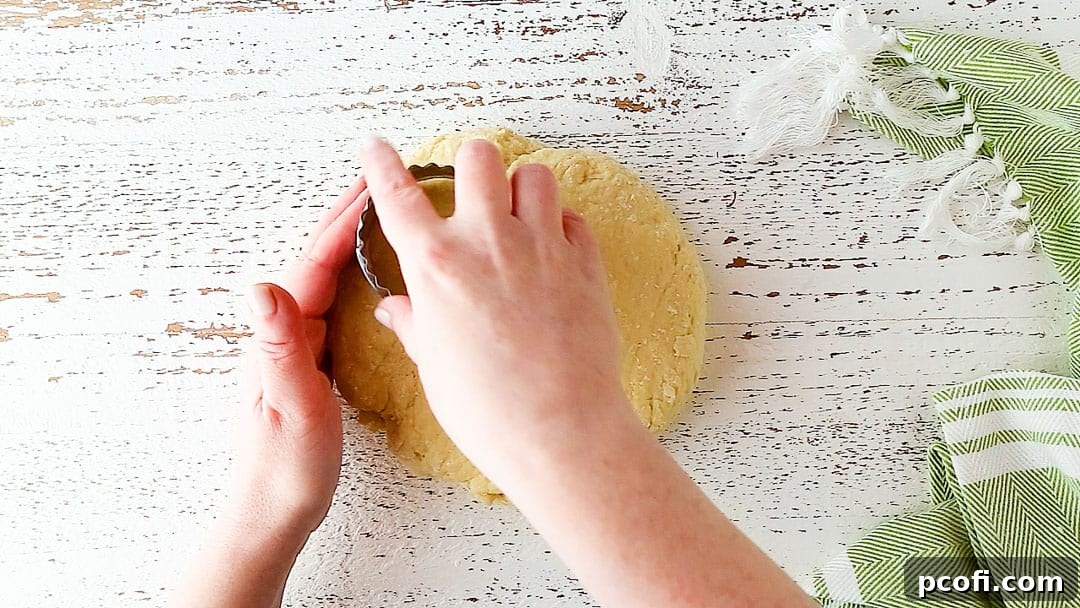 Cutting Irish scones with a 2 1/2-inch round cutter from a flattened disc.