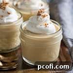 A serving of smooth, creamy homemade butterscotch pudding, ready to be enjoyed as a comforting dessert.