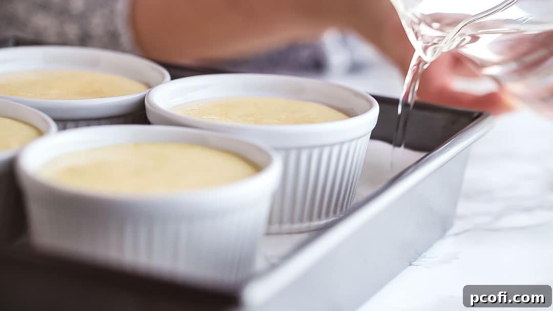 Setting up a water bath for baking lemon pudding cakes in ramekins.