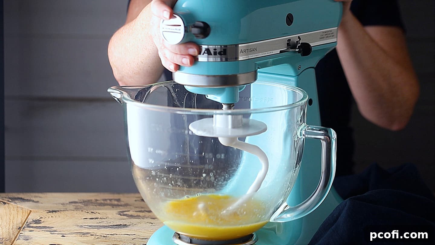 Adding eggs and oil to yeast mixture.