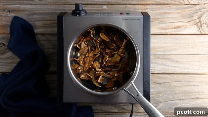 Soaking dried mushrooms in a pot of simmering water.