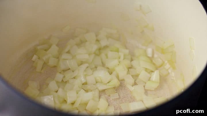 Sauteing onion in a large pot until softened.