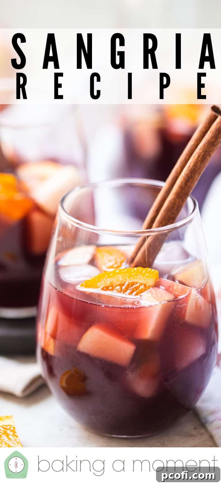 Close-up of sangria in a wine glass, highlighting the rich red color and floating fruit slices, with a text overlay of 'Sangria Recipe'.