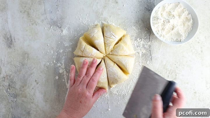 Dividing dough into 8 equal portions.