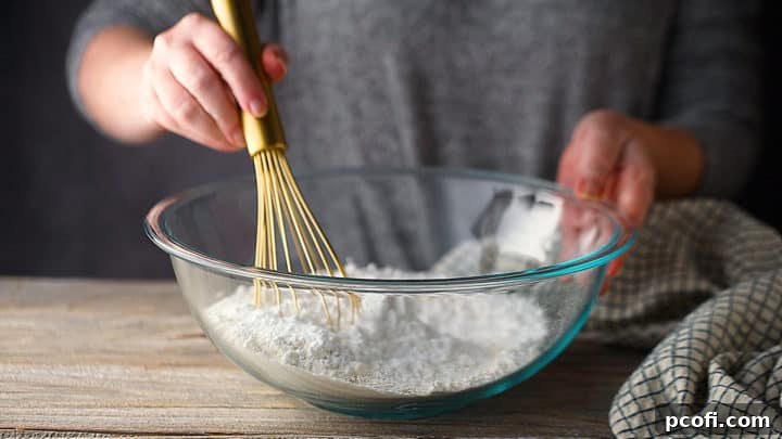 Whisking dry ingredients together for shortbread crust.