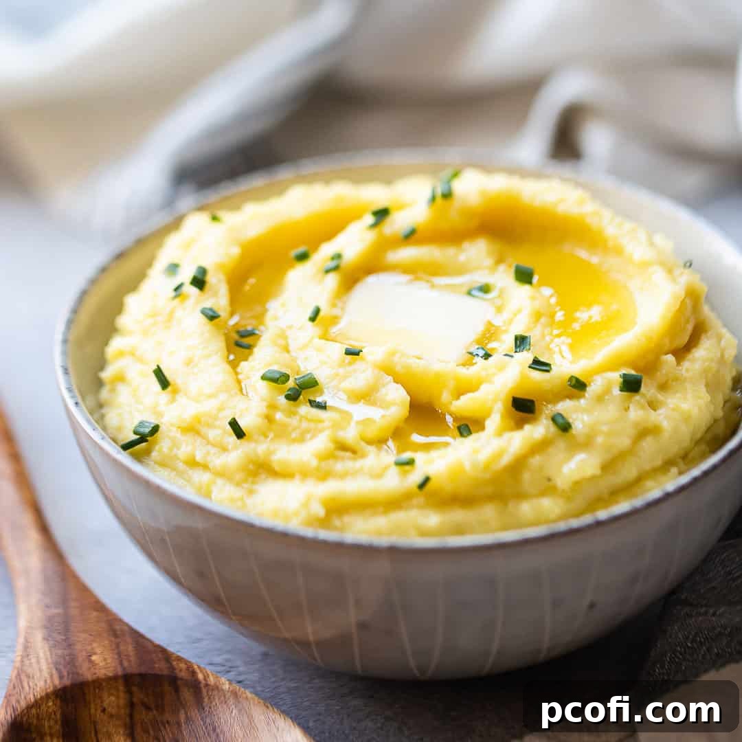 Make-ahead mashed potatoes served in a stoneware bowl with butter, ready for a delicious meal.