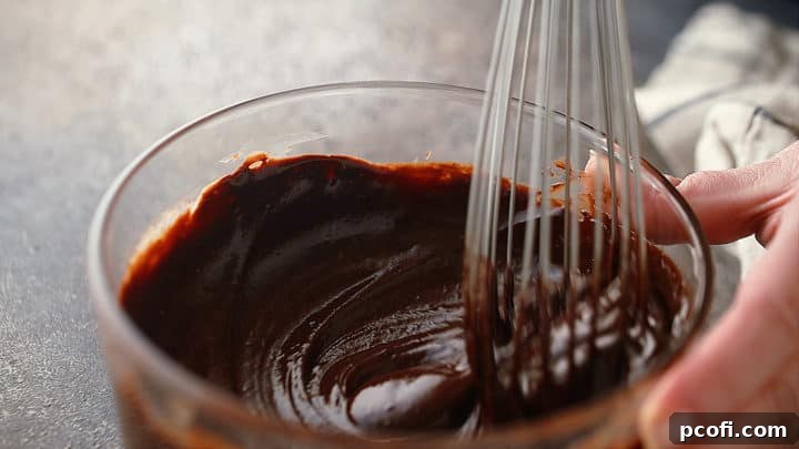 Whisking chocolate ganache.