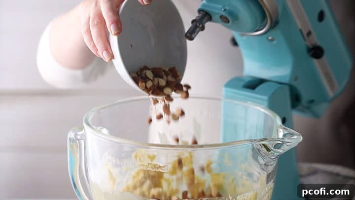 Adding roughly chopped toasted almonds.
