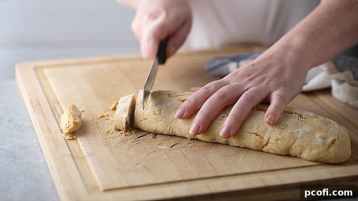 Cutting loaves into 1/2-inch thick slices.