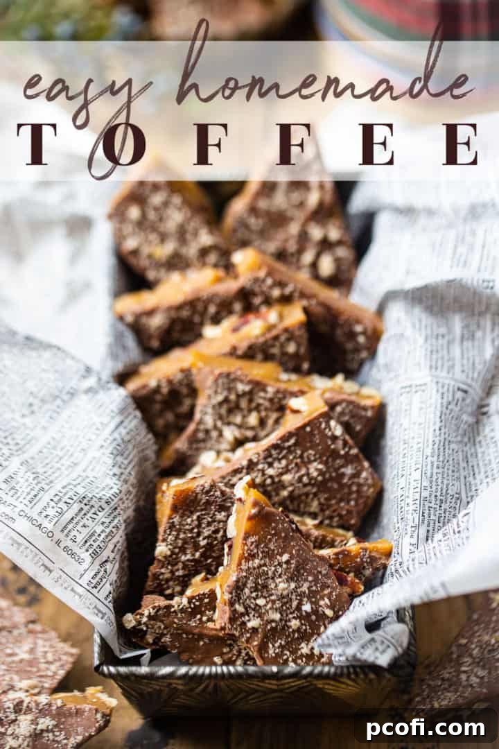 Delicious homemade toffee recipe, beautifully presented in a vintage loaf pan lined with newspaper for a rustic charm.