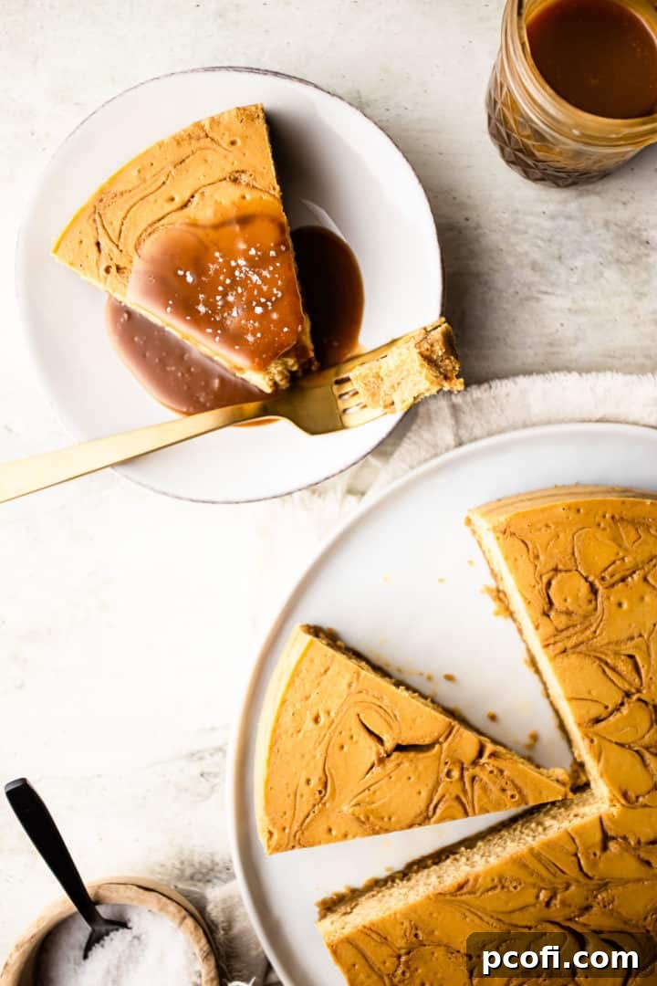 Overhead image of caramel cheesecake recipe, prepared, sliced, and served on white plates with caramel sauce and sea salt.