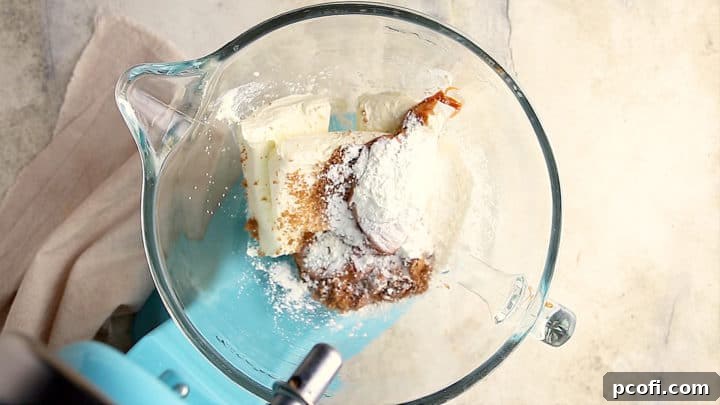Cream cheese, brown sugar, caramel, cornstarch, and salt in a large mixing bowl.