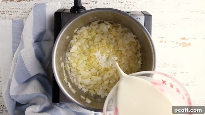 Sauteing onions and adding cream and milk.