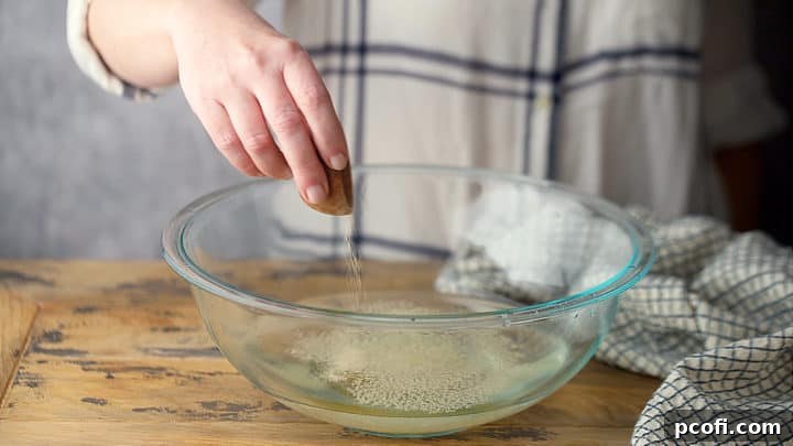 Dissolving active dry yeast in honey water.