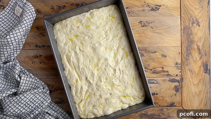 Transferring the dough to a baking dish.