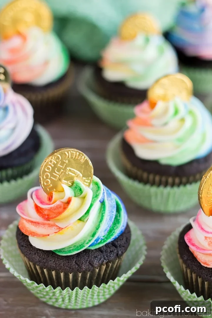 Pot of Gold Cupcakes with rainbow frosting and a gold chocolate coin for St. Patrick's Day