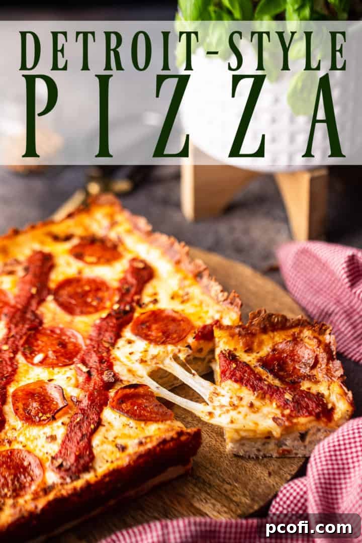 Close-up image of a freshly baked Detroit-style pizza, highlighting its thick, fluffy crust and golden, crispy cheese edges. Served on a wooden board with a text overlay that reads "Detroit-Style Pizza."