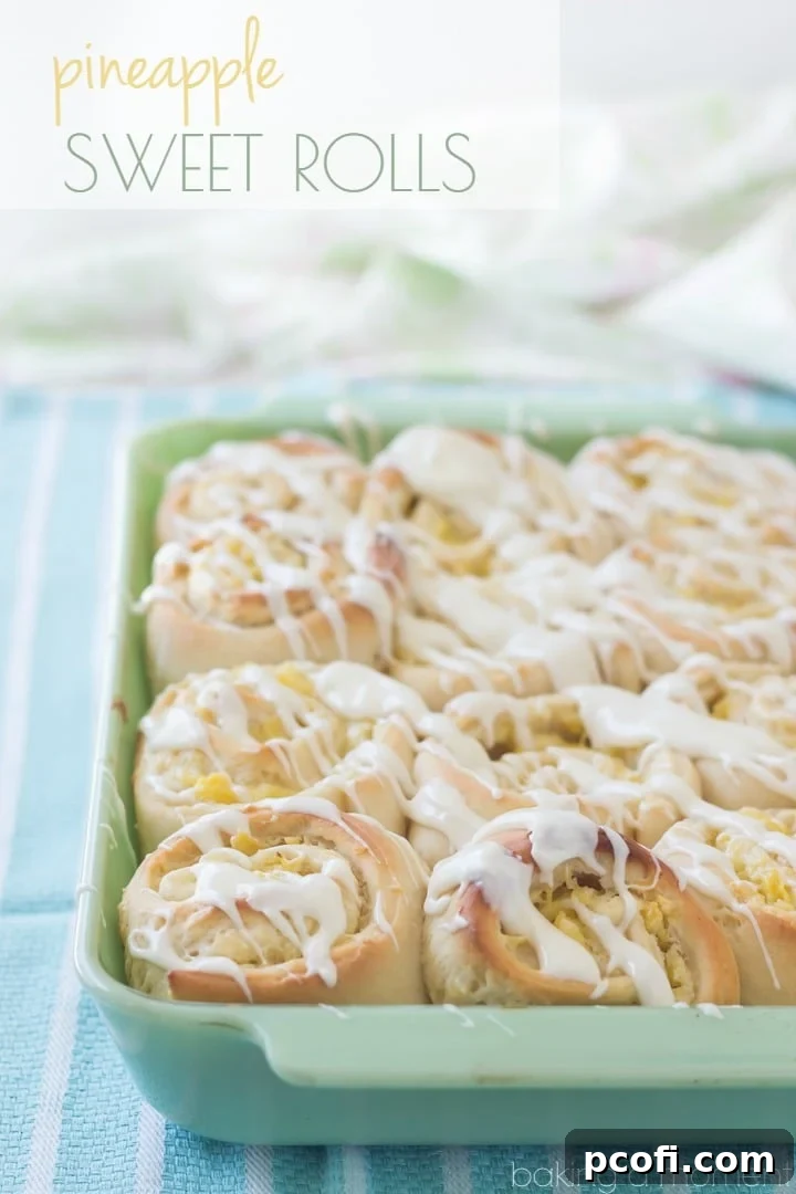 Delicious Pineapple Cream Cheese Sweet Rolls baked to golden perfection, showing their soft, gooey interior filled with tropical goodness. #OnlyPhiladelphia #MyCreamCheese @LoveMyPhilly #sponsored