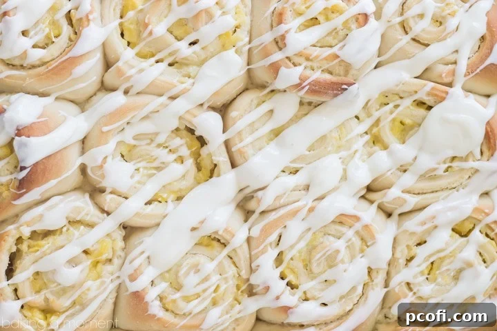 Close-up of Pineapple Cream Cheese Sweet Rolls, showcasing the lush pineapple cream cheese filling and the perfectly baked, golden-brown dough. #OnlyPhiladelphia #MyCreamCheese @LoveMyPhilly #sponsored