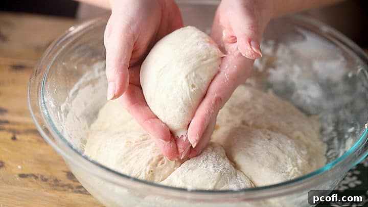 Shaping individual bread bowl loaves.