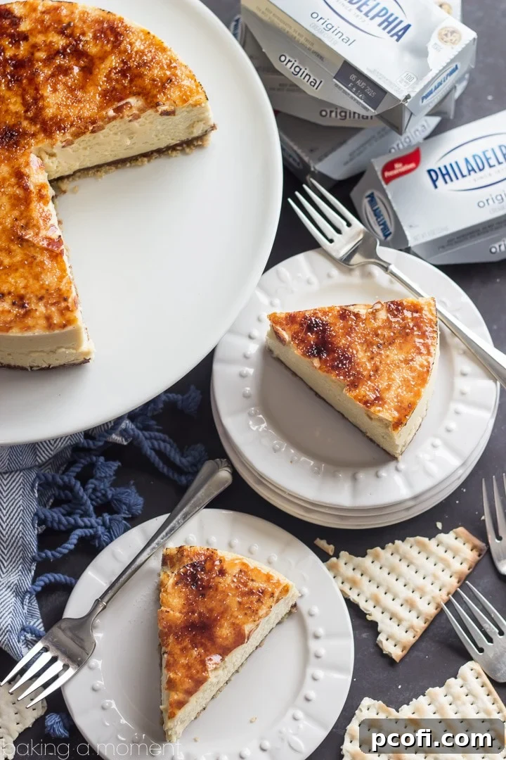 The golden, caramelized brulee topping on this Toffee Crunch Cheesecake adds an exquisite crackle and a touch of burnt sugar perfection to every slice, making it an elegant and unforgettable dessert.