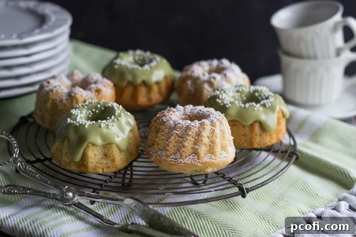 A perfectly baked matcha almond mini bundt cake, adorned with nonpareil sprinkles and a fresh matcha glaze, ready to be enjoyed as a healthy snack.