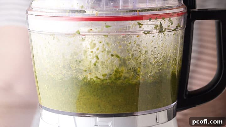 Blending pesto in a food processor.