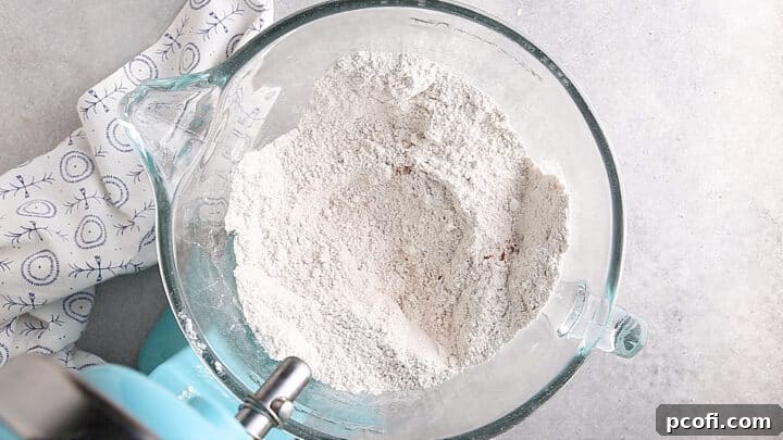 Flour, sugar, leavening, and spices for pumpkin bundt cake.