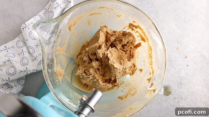 Pumpkin bundt cake batter with eggs, before adding other liquid ingredients.