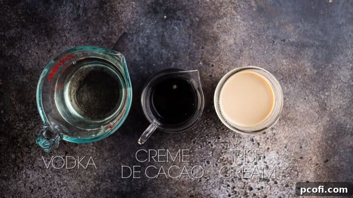 Chocolate martini ingredients on a dark textured background.