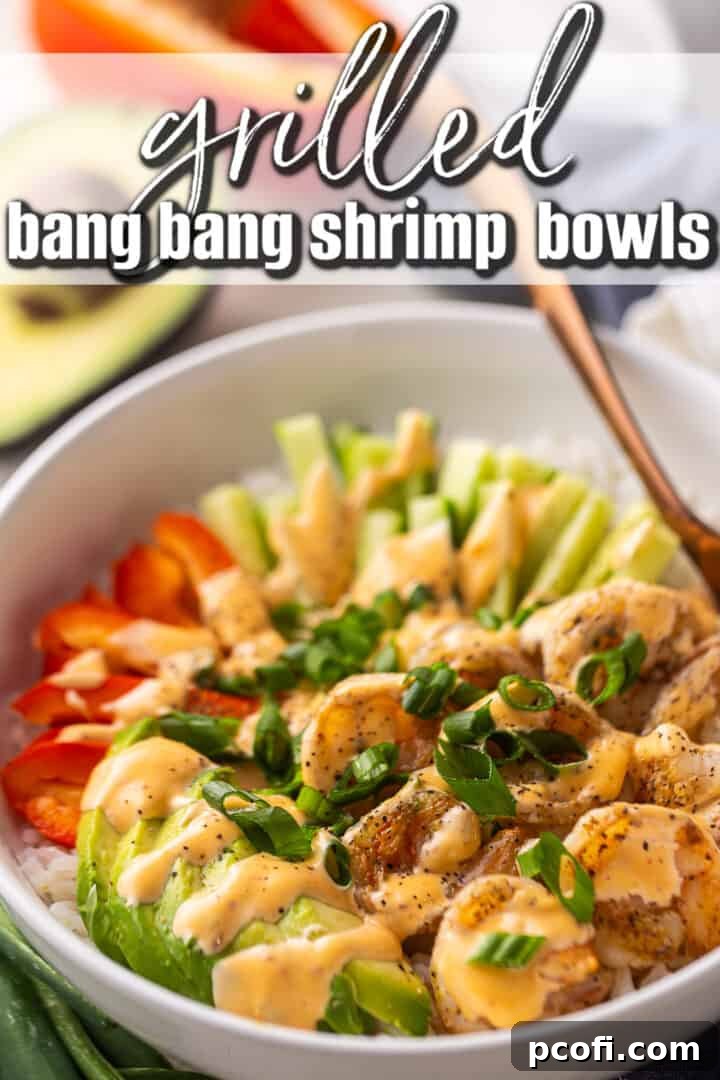 Bang bang shrimp recipe prepared and served in a bowl with rice and vegetables.