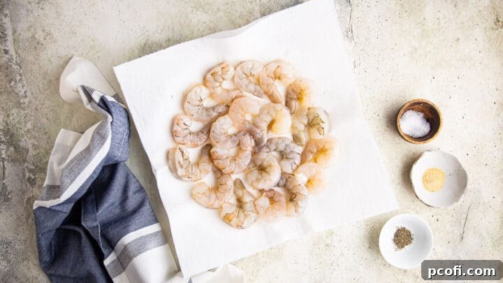 Raw shrimp with salt, garlic powder, and pepper.