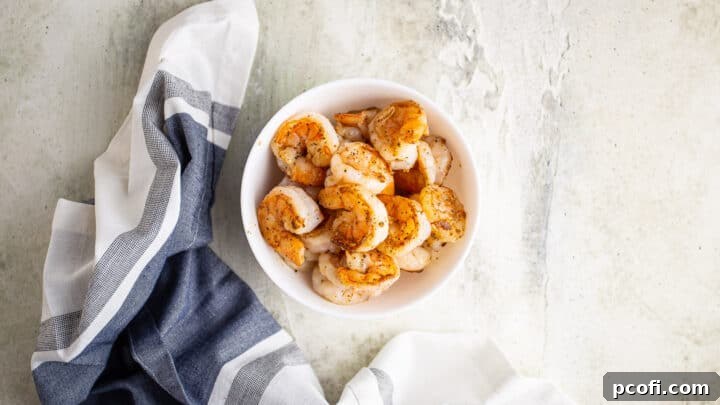 Grilled shrimp in a white bowl.