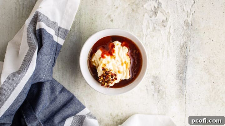 Ingredients for bang bang sauce in a small bowl.