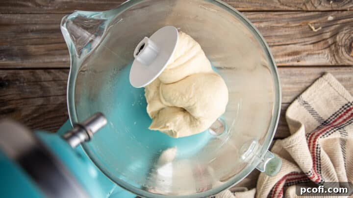 Pretzel bun dough after 10 minutes of thorough kneading, showing a smooth and elastic texture.
