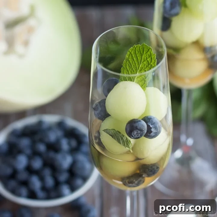Simple as can be and so refreshing! These melon balls in tea with blueberries and mint will definitely be making an appearance at our next brunch! #puresummer #ad